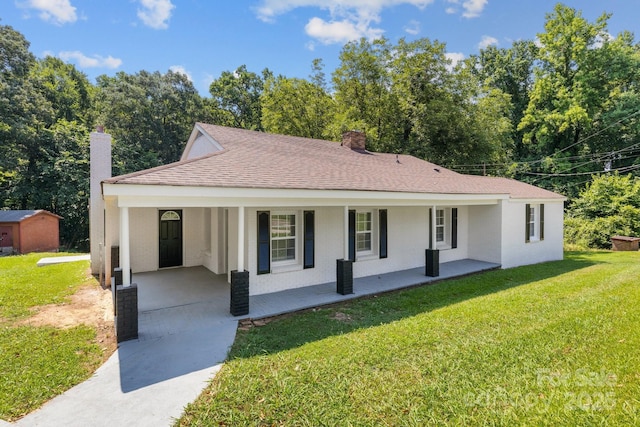 509 8th Avenue Ext, Cramerton, NC 28032 - single story home featuring a chimney, driveway, a carport, covered porch, and a front lawn