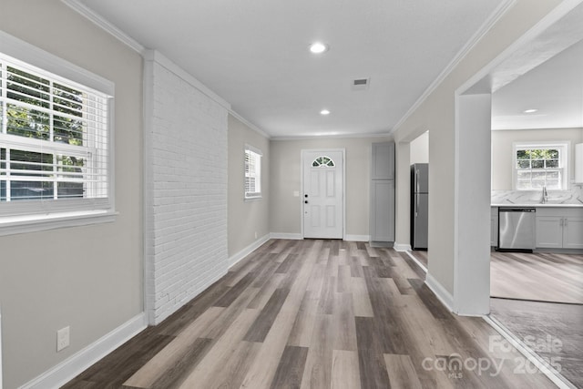 509 8th Avenue Ext, Cramerton, NC 28032 - entryway featuring healthy amount of natural light, wood finished floors, ornamental molding, and recessed lighting