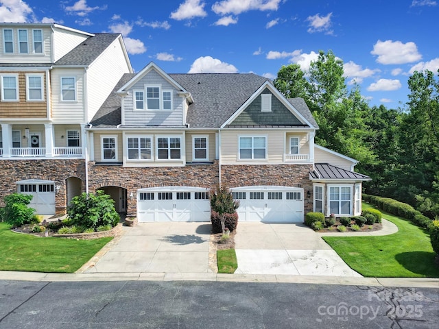 329 Wave Crest Dr, Tega Cay, SC 29708 - view of front of property featuring stone siding, concrete driveway, an attached garage, and a front lawn