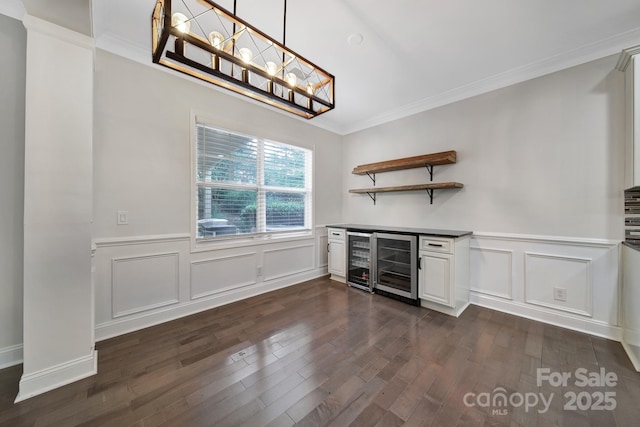 329 Wave Crest Dr, Tega Cay, SC 29708 - indoor dry bar featuring wine cooler, dark wood-type flooring, ornamental molding, a decorative wall, and a chandelier