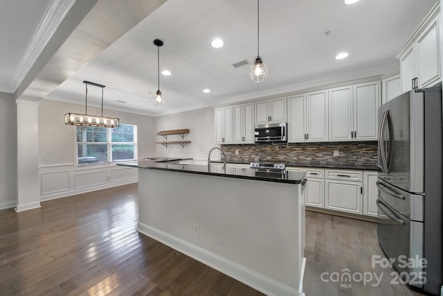 329 Wave Crest Dr, Tega Cay, SC 29708 - kitchen featuring stainless steel appliances, dark wood finished floors, white cabinetry, tasteful backsplash, and crown molding