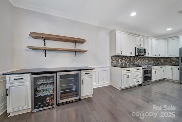 329 Wave Crest Dr, Tega Cay, SC 29708 - indoor dry bar with stainless steel appliances, beverage cooler, ornamental molding, dark wood-style flooring, and recessed lighting