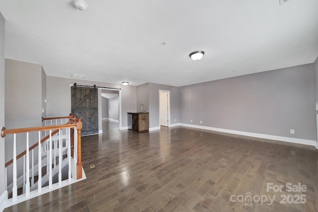 329 Wave Crest Dr, Tega Cay, SC 29708 - unfurnished living room with a barn door and wood finished floors
