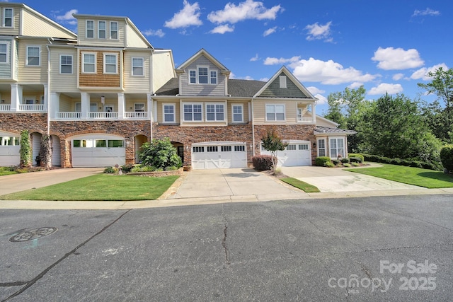 329 Wave Crest Dr, Tega Cay, SC 29708 - townhome / multi-family property with stone siding, driveway, an attached garage, and a front lawn