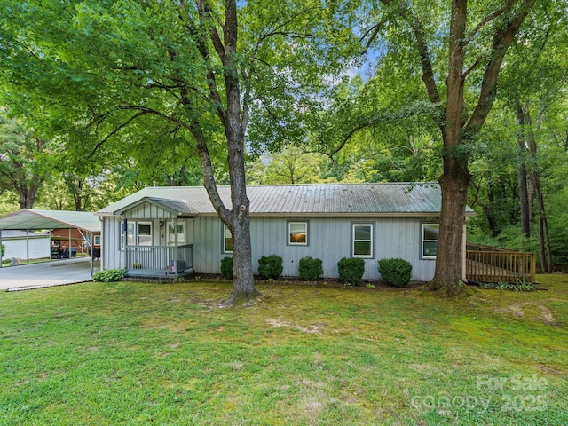 5007 Rehobeth Rd, Waxhaw, NC 28173 - single story home featuring a front yard, board and batten siding, and a metal roof