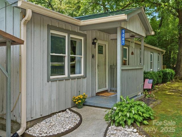 5007 Rehobeth Rd, Waxhaw, NC 28173 - doorway to property with board and batten siding and a metal roof