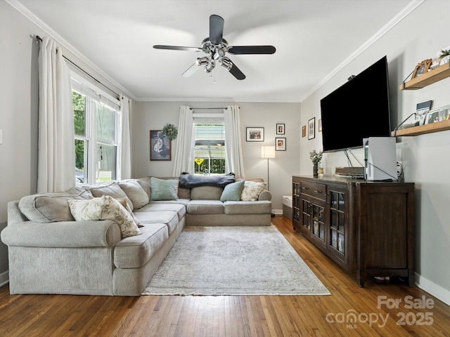 5007 Rehobeth Rd, Waxhaw, NC 28173 - living room with healthy amount of natural light, ceiling fan, wood finished floors, and crown molding