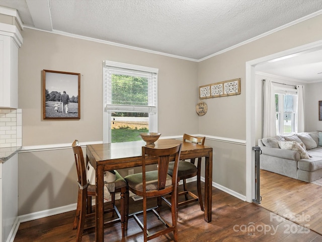 5007 Rehobeth Rd, Waxhaw, NC 28173 - dining area with dark wood-style floors, a textured ceiling, and crown molding
