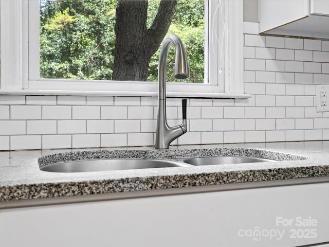 5007 Rehobeth Rd, Waxhaw, NC 28173 - kitchen with tasteful backsplash and white cabinetry