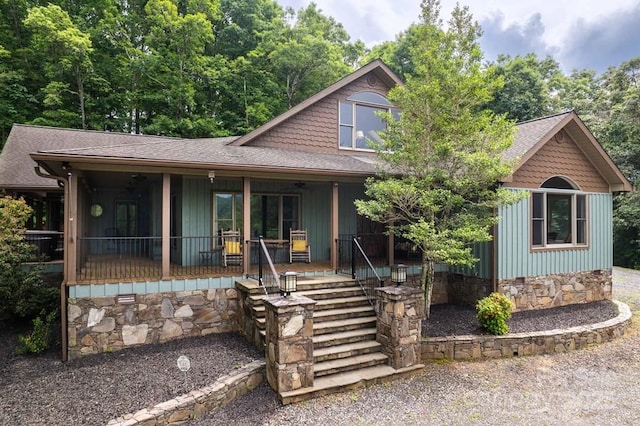 486 Center Dr Unit 7B, Bryson City, NC 28713 - view of front of house featuring roof with shingles and a porch