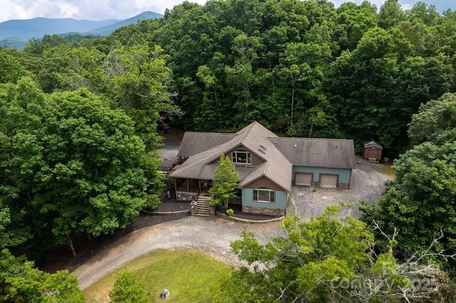 486 Center Dr Unit 7B, Bryson City, NC 28713 - view from above of property featuring a forest and mountains