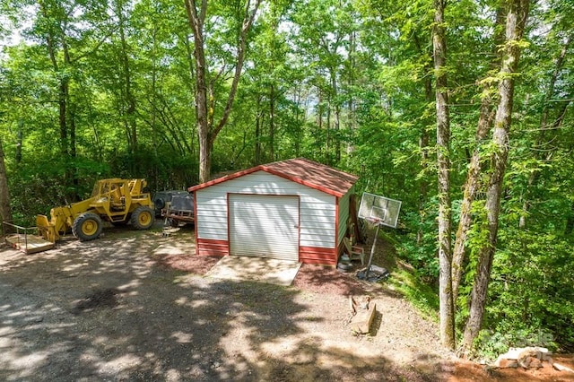 486 Center Dr Unit 7B, Bryson City, NC 28713 - garage featuring a view of trees