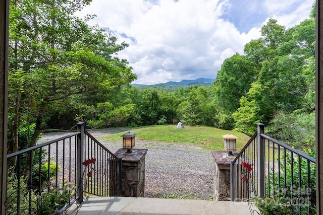 486 Center Dr Unit 7B, Bryson City, NC 28713 - view of patio featuring a wooded view
