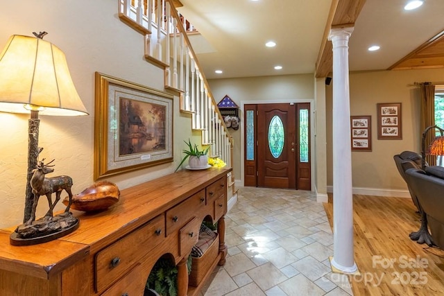 486 Center Dr Unit 7B, Bryson City, NC 28713 - entrance foyer with ornate columns, stairs, stone tile flooring, and recessed lighting