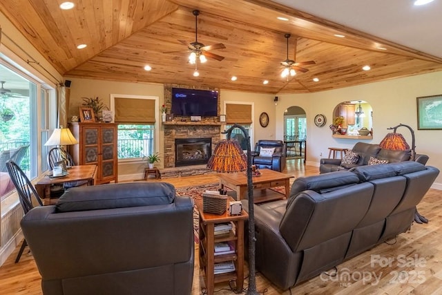 486 Center Dr Unit 7B, Bryson City, NC 28713 - living area featuring recessed lighting, arched walkways, ceiling fan, a stone fireplace, and light wood-type flooring