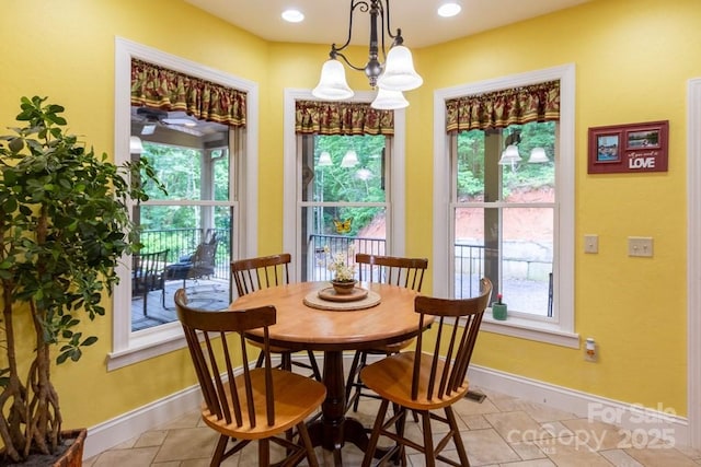 486 Center Dr Unit 7B, Bryson City, NC 28713 - dining area with light tile patterned floors and a chandelier