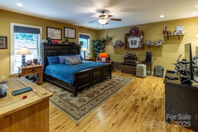 486 Center Dr Unit 7B, Bryson City, NC 28713 - bedroom with light wood finished floors, recessed lighting, and a ceiling fan