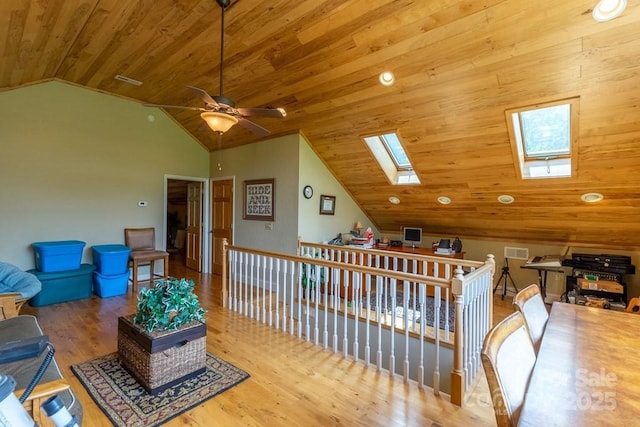 486 Center Dr Unit 7B, Bryson City, NC 28713 - living room with a skylight, lofted ceiling, wood ceiling, a ceiling fan, and wood finished floors
