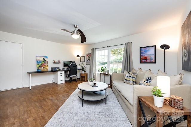 2620 Park Rd Unit F, Charlotte, NC 28209 - living area featuring dark wood finished floors, a desk, and a ceiling fan