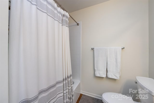 2620 Park Rd Unit F, Charlotte, NC 28209 - bathroom featuring toilet and shower / bath combo with shower curtain