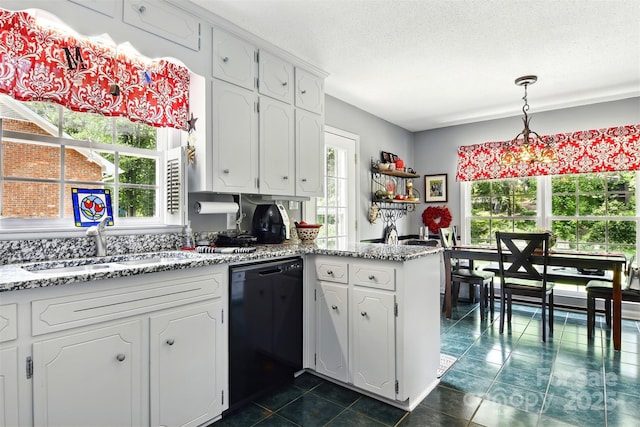 701 4th Ave NE, Conover, NC 28613 - kitchen with dishwasher, a peninsula, white cabinetry, dark tile patterned floors, and a textured ceiling