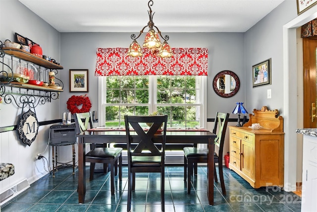 701 4th Ave NE, Conover, NC 28613 - dining area featuring dark tile patterned floors and a chandelier