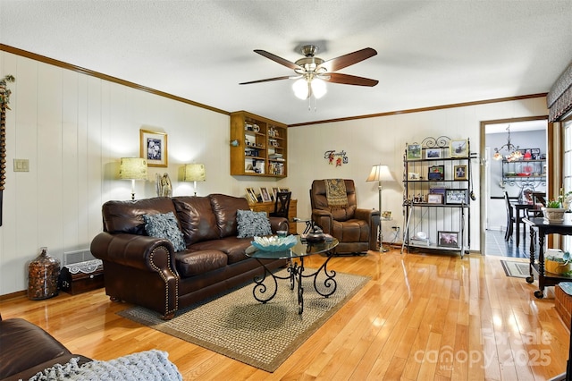 701 4th Ave NE, Conover, NC 28613 - living room with ceiling fan, crown molding, and hardwood / wood-style flooring