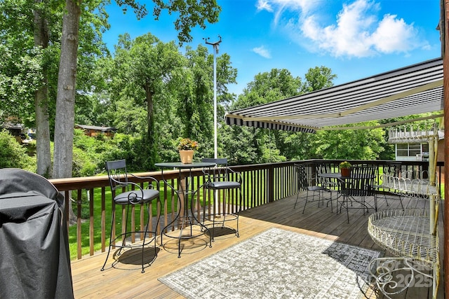 701 4th Ave NE, Conover, NC 28613 - wooden terrace featuring outdoor dining area and view of wooded area