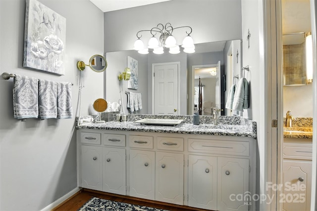701 4th Ave NE, Conover, NC 28613 - full bath featuring double vanity and wood finished floors