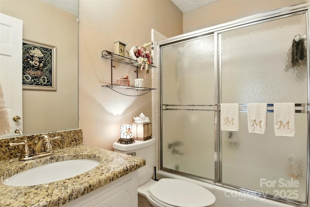 701 4th Ave NE, Conover, NC 28613 - full bath with vanity, enclosed tub / shower combo, and a textured ceiling