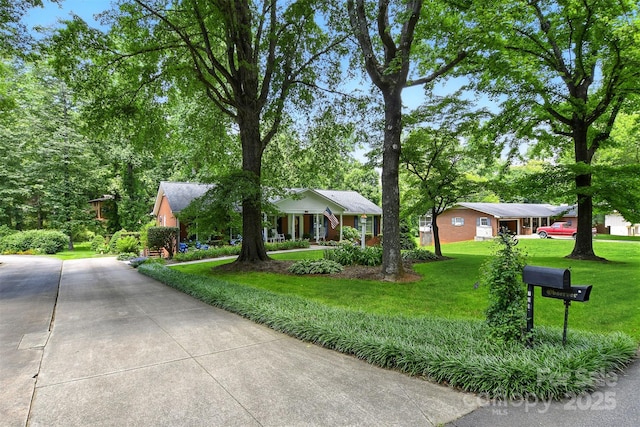 701 4th Ave NE, Conover, NC 28613 - view of front of home with a front yard and concrete driveway