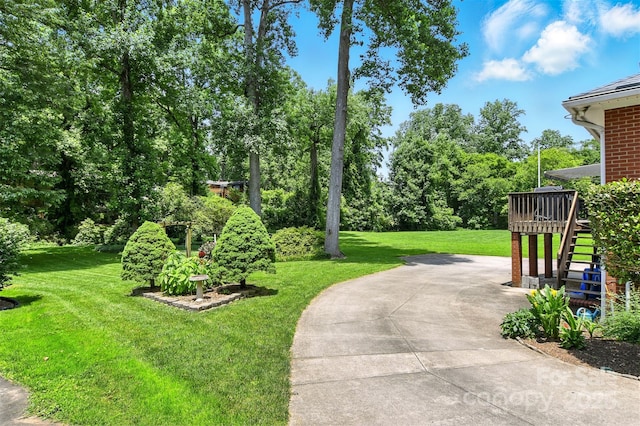 701 4th Ave NE, Conover, NC 28613 - view of grassy yard with stairs, a patio, a wooden deck, and view of scattered trees