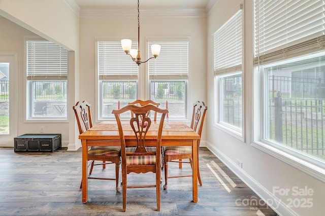 469 Summerfield Pl, Flat Rock, NC 28731 - dining room featuring a chandelier, crown molding, healthy amount of natural light, and dark wood-style flooring