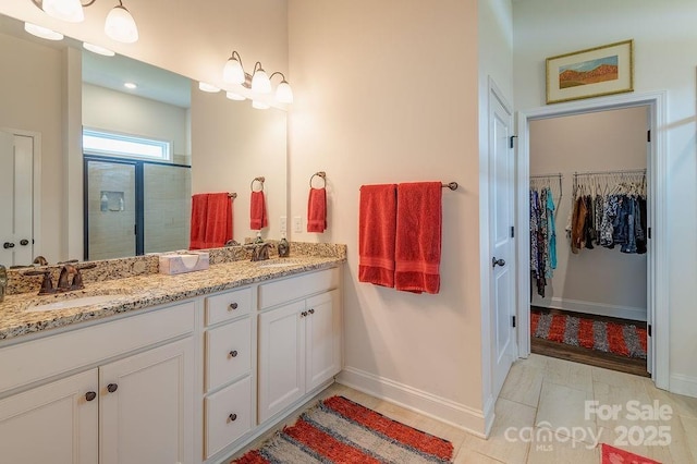 469 Summerfield Pl, Flat Rock, NC 28731 - full bath with double vanity, a tile shower, and a spacious closet