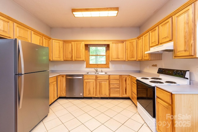 25 Trillium Trce, Maggie Valley, NC 28751 - kitchen featuring appliances with stainless steel finishes, under cabinet range hood, light countertops, and light tile patterned floors