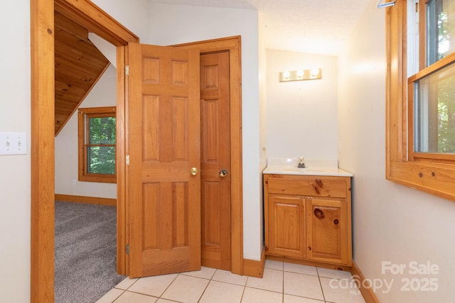25 Trillium Trce, Maggie Valley, NC 28751 - bathroom featuring vaulted ceiling, vanity, and tile patterned flooring