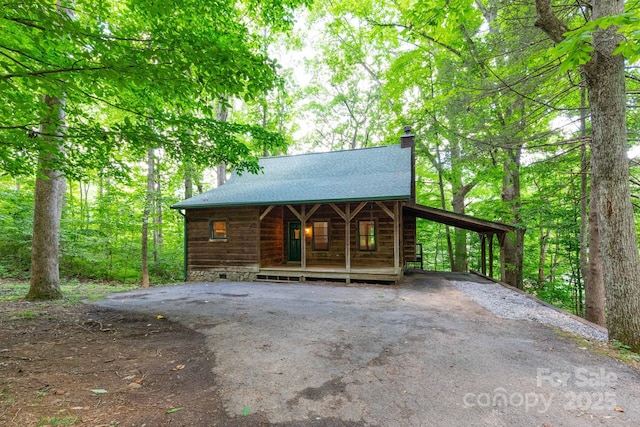 25 Trillium Trce, Maggie Valley, NC 28751 - chalet / cabin with a chimney, asphalt driveway, and a carport
