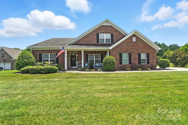 1006 Spring Rose Ln, Matthews, NC 28104 - traditional home with brick siding, a front lawn, and a porch
