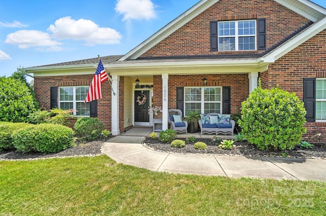 1006 Spring Rose Ln, Matthews, NC 28104 - view of front of home featuring brick siding and a porch