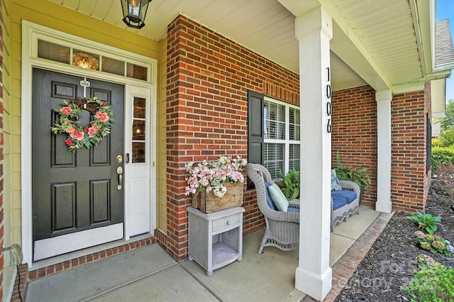 1006 Spring Rose Ln, Matthews, NC 28104 - view of exterior entry featuring covered porch and brick siding