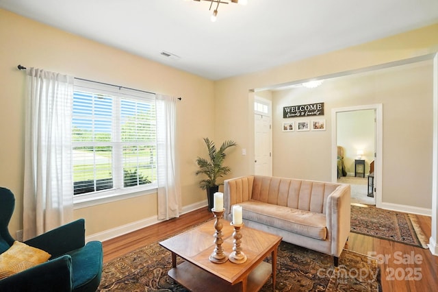1006 Spring Rose Ln, Matthews, NC 28104 - living area featuring wood finished floors and healthy amount of natural light