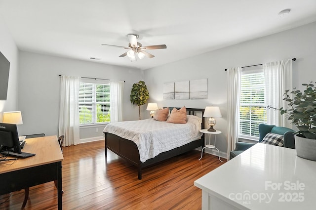 1006 Spring Rose Ln, Matthews, NC 28104 - bedroom with wood finished floors, a desk, and a ceiling fan