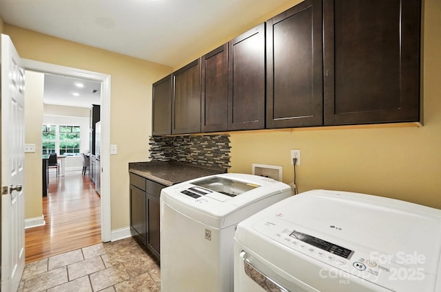 1006 Spring Rose Ln, Matthews, NC 28104 - laundry room featuring cabinet space and washing machine and dryer