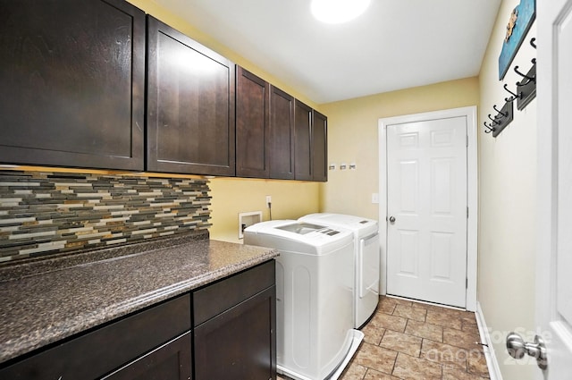 1006 Spring Rose Ln, Matthews, NC 28104 - washroom featuring cabinet space, stone finish floors, and washer and clothes dryer