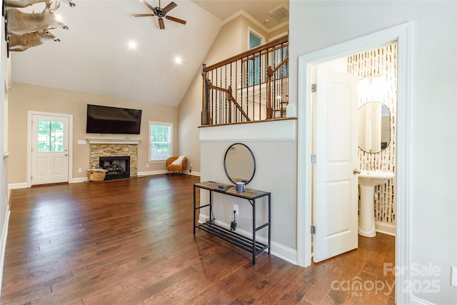 4203 Flint Dr, Lancaster, SC 29720 - unfurnished living room featuring a ceiling fan, high vaulted ceiling, wood finished floors, a fireplace, and stairs