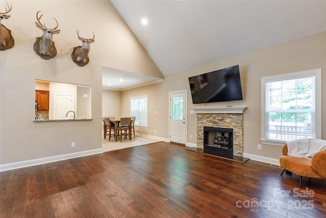 4203 Flint Dr, Lancaster, SC 29720 - living room featuring hardwood / wood-style flooring, high vaulted ceiling, and a fireplace
