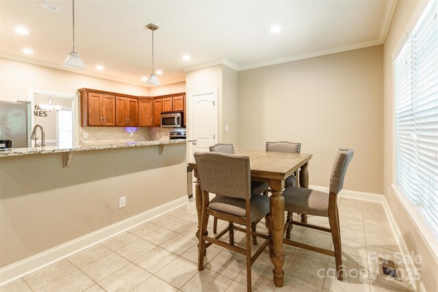 4203 Flint Dr, Lancaster, SC 29720 - dining space with light tile patterned floors, healthy amount of natural light, ornamental molding, and recessed lighting