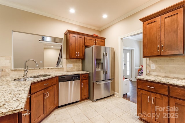 4203 Flint Dr, Lancaster, SC 29720 - kitchen with appliances with stainless steel finishes, tasteful backsplash, ornamental molding, light tile patterned flooring, and light stone countertops