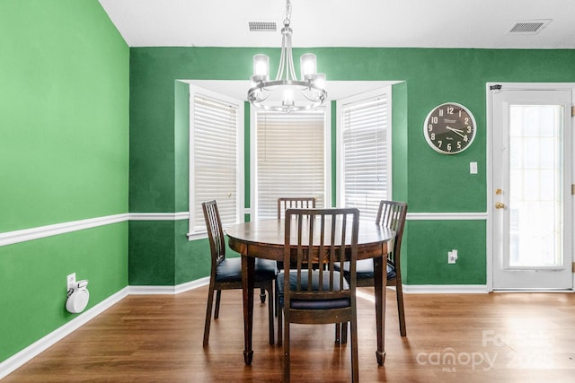 4614 Jacquelyne Dr, Indian Trail, NC 28079 - dining area with a chandelier, wood finished floors, and plenty of natural light