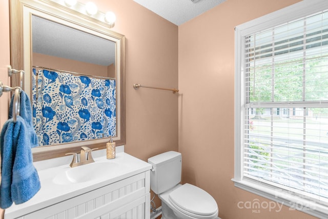 4614 Jacquelyne Dr, Indian Trail, NC 28079 - bathroom with plenty of natural light, vanity, and a textured ceiling